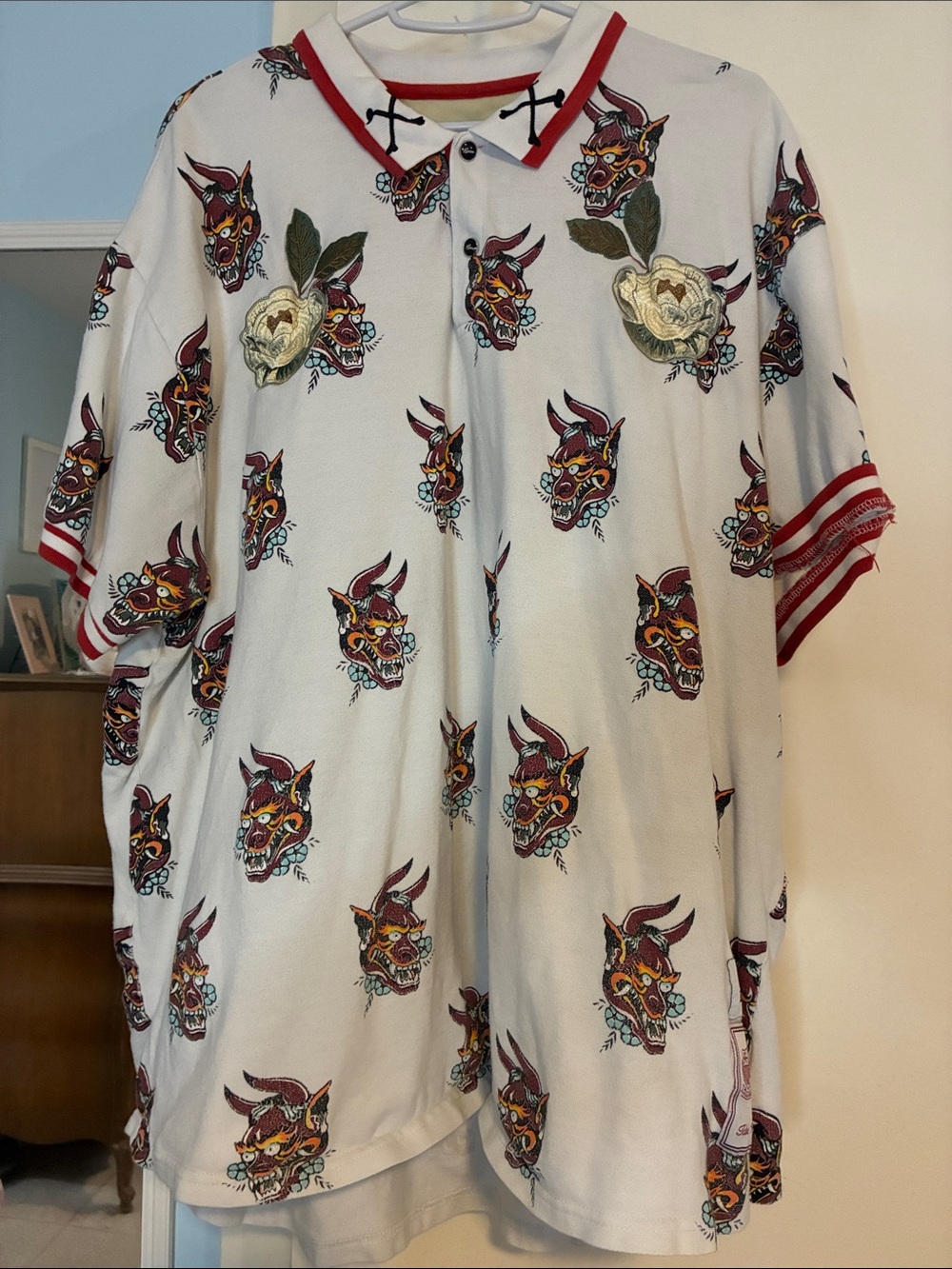 Reason Cream Polo with Demon Head Print and Red Trim Accents